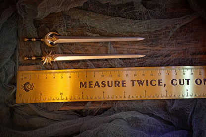 Measurement of sword pins (~15.5 cm) next to a ruler.