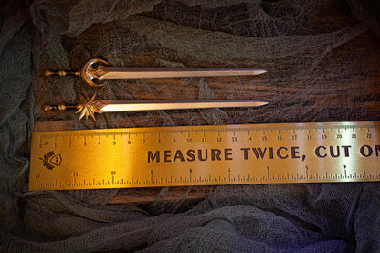 Measurement of sword pins (~15.5 cm) next to a ruler.